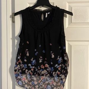 Sleeveless black blouse with pink and blue flowers. Size large